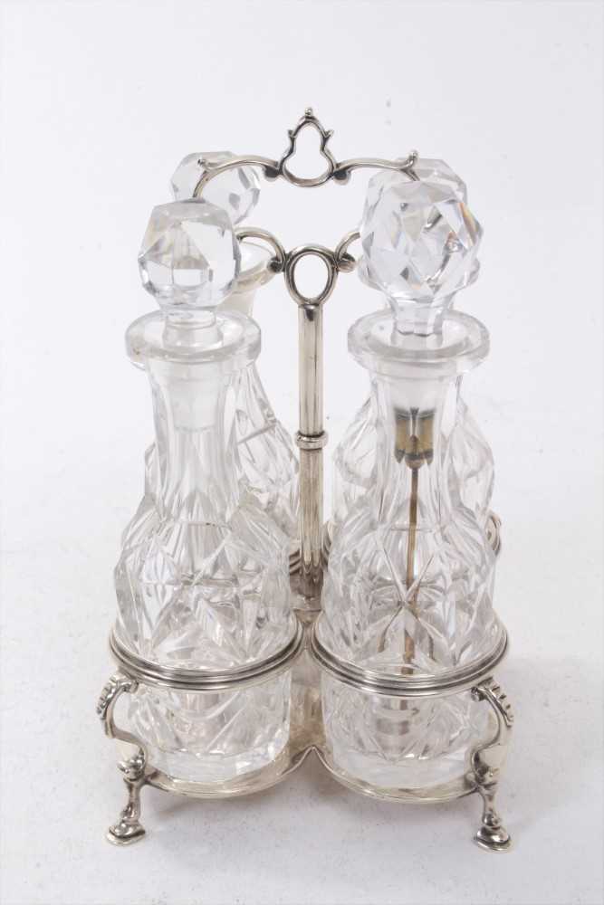 Lot 264 - Victorian four bottle silver cruet frame,