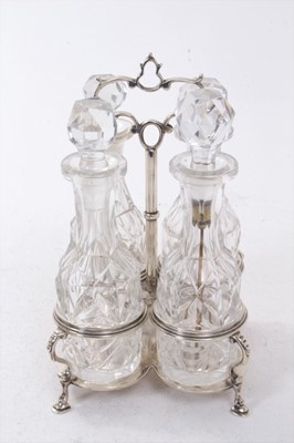 Lot 264 - Victorian four bottle silver cruet frame, with quatrefoil base and central carrying handle