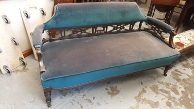 Lot 1247 - Edwardian mahogany framed salon sofa with blue upholstery on turned front legs