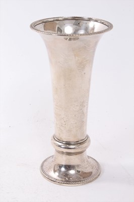 Lot 274 - 1920s silver trumpet vase, with flared rim and raised girdle, on a loaded circular base