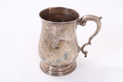 Lot 383 - George III silver tankard of baluster form with scroll handle on circular foot, (London 1765), maker William & James Priest, all at 8.5ozs, 11.5cm in height