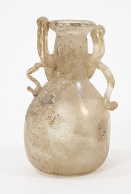 Lot 131 - Roman glass vase and a pottery flask