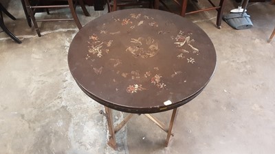 Lot 1279 - Chinese lacquered circular occasional table on folding base and a red painted wicker circular table (2)