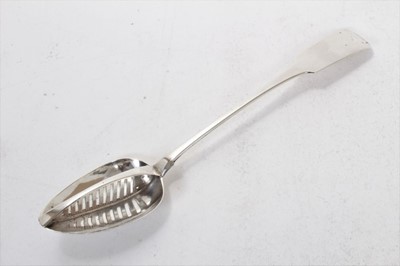 Lot 287 - George III Irish silver fiddle pattern straining spoon, with central pierced grille (Dublin 1812)