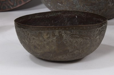 Lot 811 - Good group of Indian and Middle Eastern metalwares, circa 19th century, including vases and bowls, with engraved and relief-form decoration