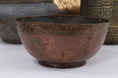 Lot 811 - Good group of Indian and Middle Eastern metalwares, circa 19th century, including vases and bowls, with engraved and relief-form decoration