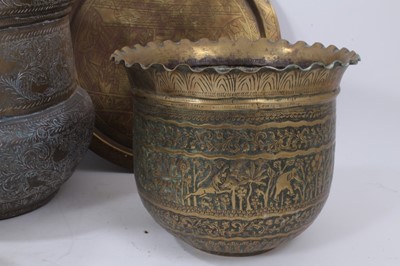 Lot 811 - Good group of Indian and Middle Eastern metalwares, circa 19th century, including vases and bowls, with engraved and relief-form decoration