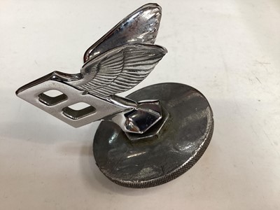 Lot 1945 - Bentley Flying B Mascot from a MKVI or R Type, together with a chromium plated mascot of a winged nymph and a car clock (3)