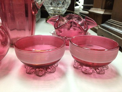 Lot 324 - Group of Victorian and later cranberry glass, including a banded pair of salts