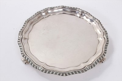 Lot 292 - 1920s silver waiter of circular form, with piecrust and gadrooned border, on three scroll feet