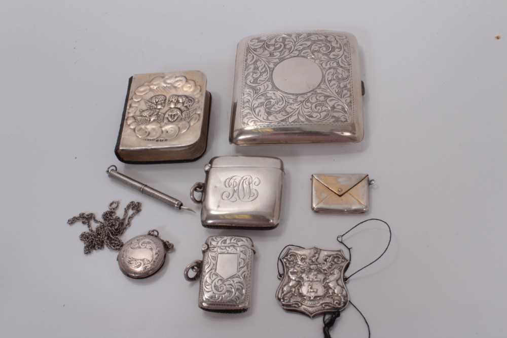 Lot 148 - George V silver cigarette case (Birmingham 1916), together with two silver vesta cases, a silver stamp case, silver badge, locket on chain, tooth