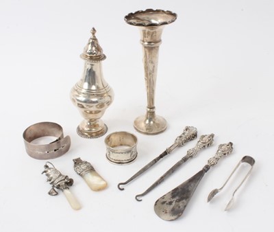 Lot 155 - George V silver sugar caster, (London 1911), together with a silver spill vase, silver and mother of pearl babies rattle and other silver items, (various dates and makers), 5ozs of weighable silver.
