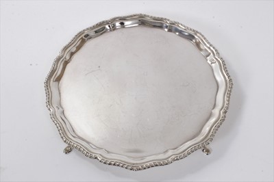 Lot 293 - George V silver salver of octagonal form, with piecrust and gadrooned border, on four hoof feet
