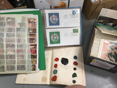 Lot 447 - Group of stamps and PHQ cards in albums, together with an album of cut paper and wax crests.