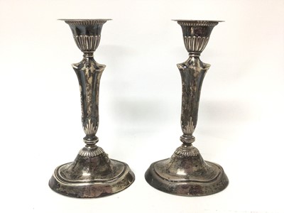 Lot 64 - Pair of Edwardian silver candlesticks (London 1903), 19cm high