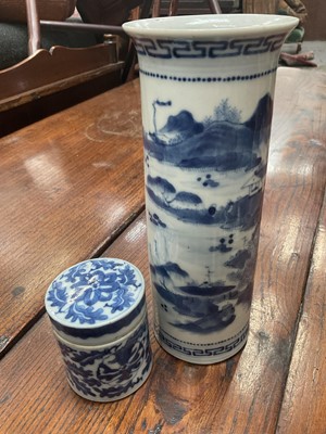 Lot 205 - 19th century Chinese blue and white pot and cover, decorated with foliate patterns, and a 19th century Chinese blue and white sleeve vase decorated with landscape scenes (2)