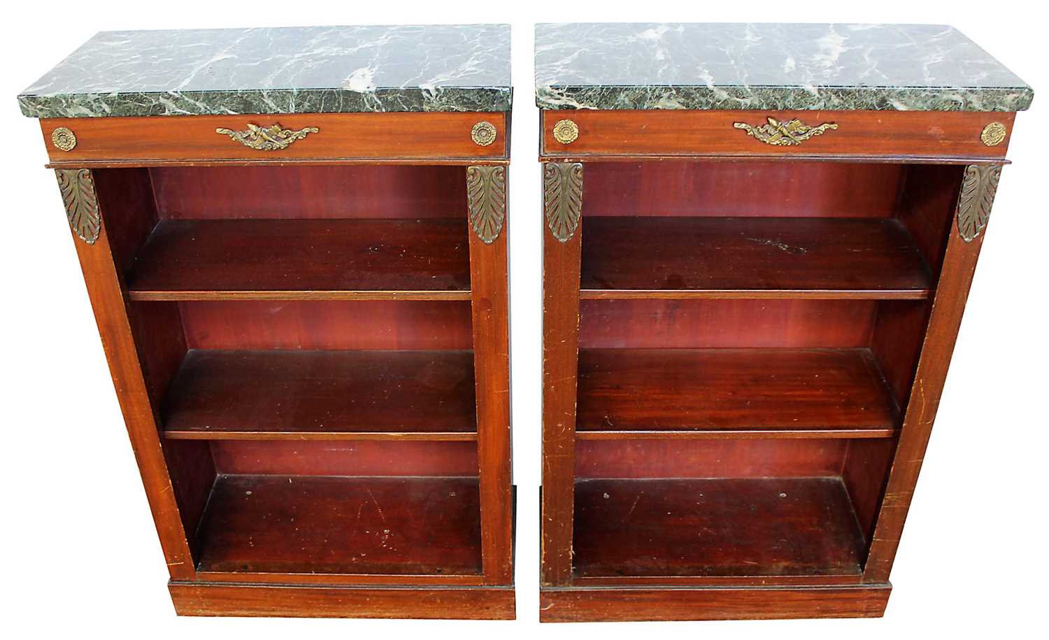 Lot 1330 - Pair of antique Empire style dwarf marble topped mahogany open bookcases