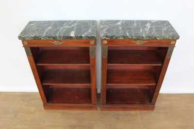 Lot 1330 - Pair of antique Empire style dwarf marble topped mahogany open bookcases