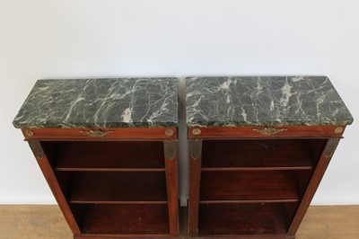 Lot 1330 - Pair of antique Empire style dwarf marble topped mahogany open bookcases