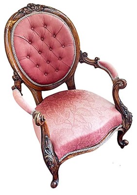 Lot 1403 - Victorian carved walnut and button upholstered open armchair.