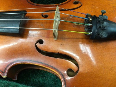 Lot 94 - Violin and bow with 'Copy of Stradivarius' label, in hard case