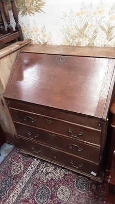 Lot 1137 - George II oak bureau with fitted interior including well, three graduated drawers below on turned feet, 76.5cm wide, 49cm deep, 96cm high