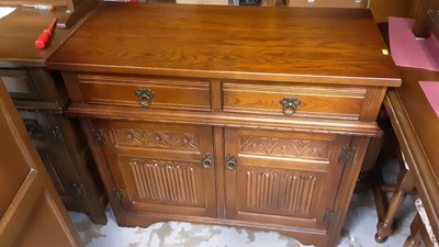 Lot 1141 - Old Charm oak sideboard with two drawers and two carved linenfold panelled doors below, 93cm wide, 43.5cm deep, 80.5cm high, together with an Old Charm corner cupboard (2)