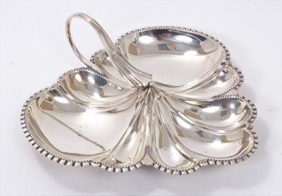 Lot 311 - Early George V silver trefoil dish of lobed form, with crimped border and loop handle