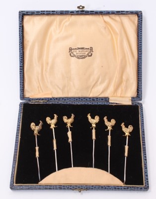 Lot 349 - Set of six 1920s silver gilt cocktail sticks in a fitted case
