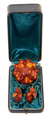 Lot 484 - 19th century amber brooch and earrings in original fitted leather box