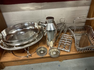 Lot 208 - Art Deco silver plated cocktail shaker, Victorian silver plated cake basket, two Victorian toast racks, two coasters and serving dish on stand