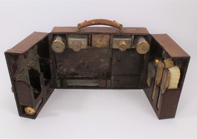 Lot 720 - Good quality fitted travelling toiletry box, with silver gilt mounted glass containers