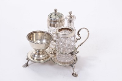 Lot 320 - Victorian silver condiment set, comprising three cut glass jars, with silver tops and a silver salt