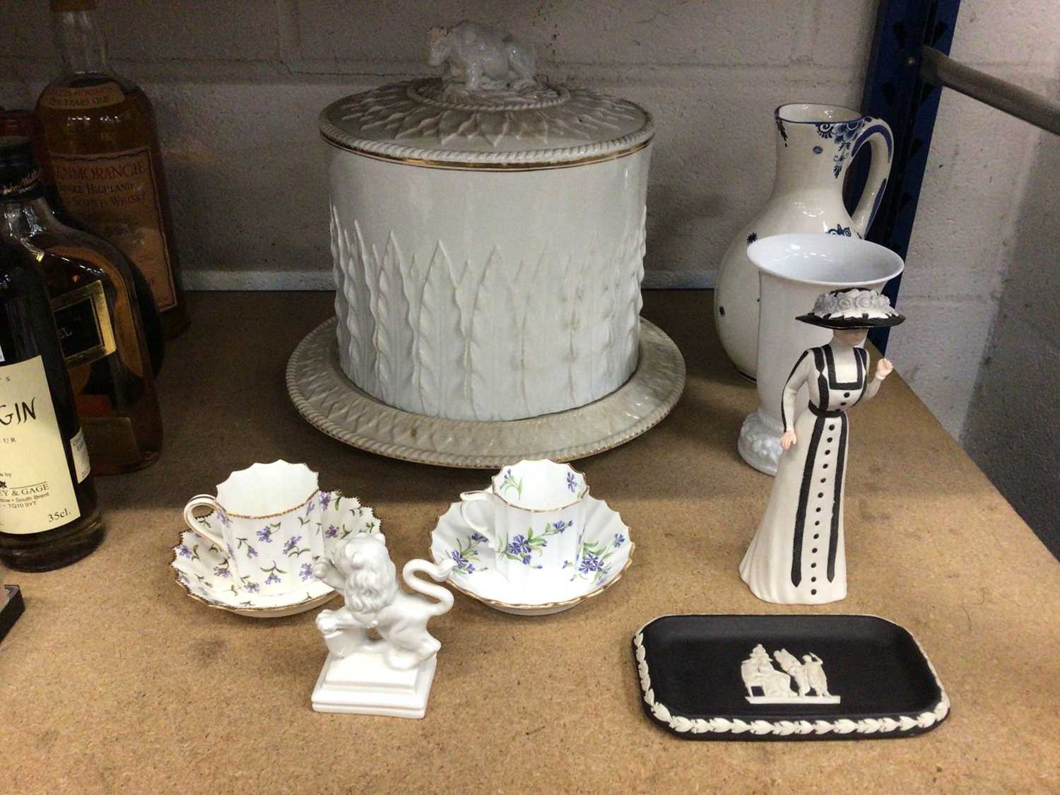 Lot 123 - Group of ceramics, including a Victorian cheese dome, Royal Worcester and Copeland cups and saucers, Nymphenburg lion, Wedgwood figure, etc