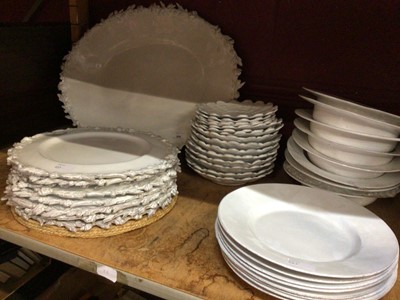 Lot 658 - White slip glazed dinner ware with floral rim platter and dinner plates