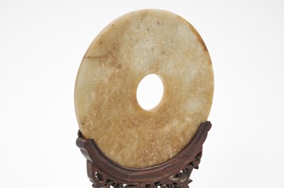 Lot 708 - Antique Chinese jade bi-disc on carved wood stand