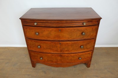 Lot 1358 - 19th century mahogany bow front chest of three long graduated drawers with brushing slide, brass handles and bracket feet