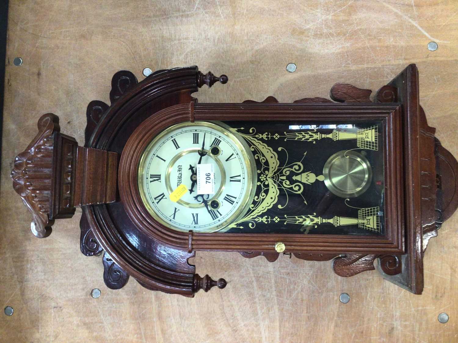 Lot 706 - A wooden case 31 day pendulum wall clock