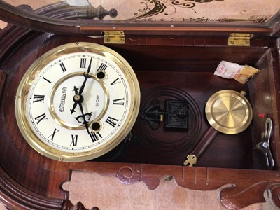 Lot 706 - A wooden case 31 day pendulum wall clock