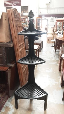 Lot 1168 - Ebonised three tier corner whatnot/plant stand, 62cm wide, 176cm high