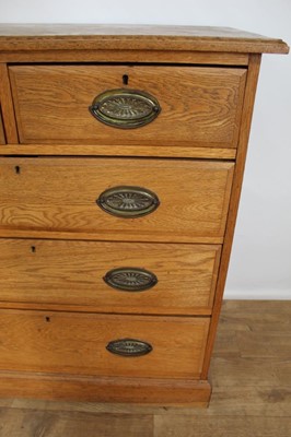 Lot 95 - Late Victorian light oak chet of two short and three long drawers with oval brass handles, on plinth base