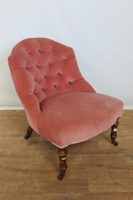 Lot 115 - Victorian nursing chair with buttoned pink velvet upholstery, on turned maohgany legs and brass castors