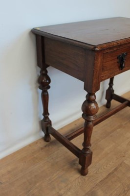 Lot 114 - Edwardian oak side table with single drawer on turned legs joined by stretchers