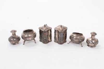 Lot 435 - 19th century six piece Chinese silver cruet set, comprising two mustard pots, two pepperettes and two salt cellars, character marks and makers marks to bases for Kwan Wo, all at 7.5ozs (6).