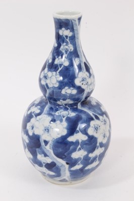 Lot 119 - 19th century Chinese blue and white double gourd vase, decorated with prunus blossom, four-character mark to base