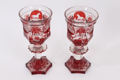 Lot 127 - Good pair of Bohemian flash cut ruby glass goblets, decorated with stags, hounds and horses, together with a similar pedestal bowl