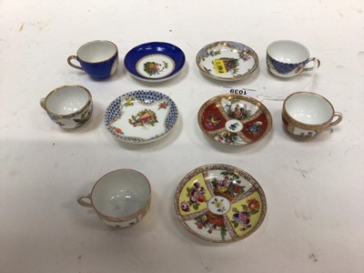 Lot 1039 - Group of miniature Meissen and Dresden cups and saucers, including floral encrusted examples