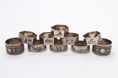 Lot 433 - Set of four White metal napkin rings of hexagonal form with niello decoration, together with four similar oval napkin rings and two others, all at 8ozs, (10)