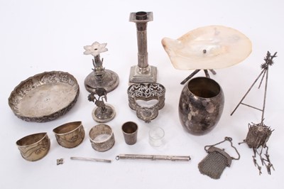 Lot 445 - Collection of Chinese silver and white metal items to include candlestick by Kwan Wo, a beaker by Wang Hing, a mother of pearl shell on silver stand and various