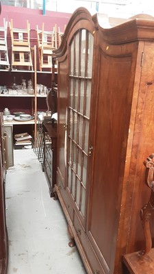 Lot 1186 - Good quality early 20th century walnut dome top triple wardrobe with central glazed door flanked by two panelled doors, with two drawers below on cabriole feet, 179cm wide, 50cm deep, 210cm high